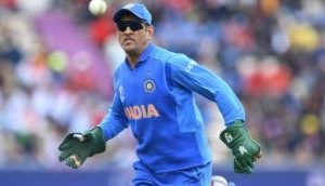 MS Dhoni's wicket keeping gloves with an emblem, tribute to Indian Army