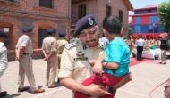 J-K: Policeman carrying slain colleague's son breaks down during wreath-laying ceremony