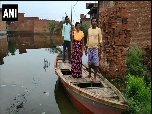 Uttar Pradesh: With severe water-logging in Moradabad, people use boats to commute