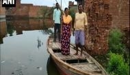 Uttar Pradesh: With severe water-logging in Moradabad, people use boats to commute