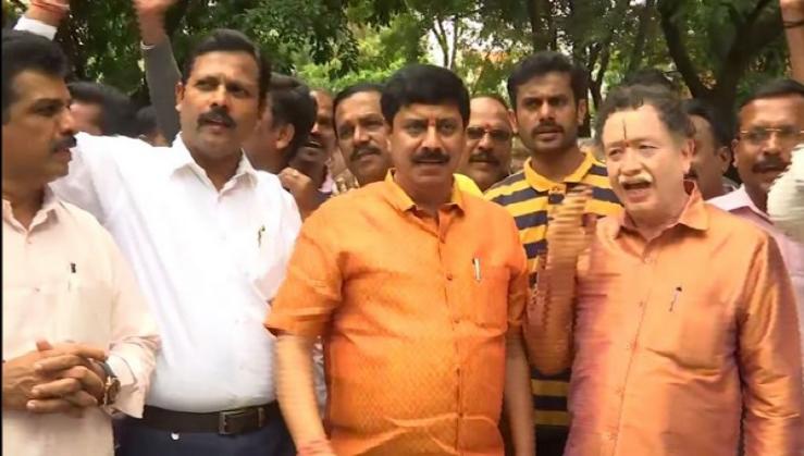 Karnataka: BJP workers celebrate outside Yeddyurappa's residence