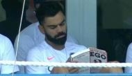 Virat Kohli spotted reading 'Detox your Ego' during first Test against West Indies