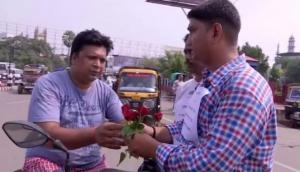 Bihar: Man distributes flowers urging people to follow traffic rules