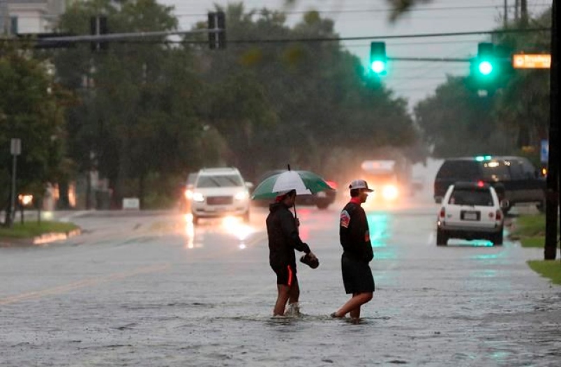 China: 2 dead as Imelda strands drivers, floods homes in Texas