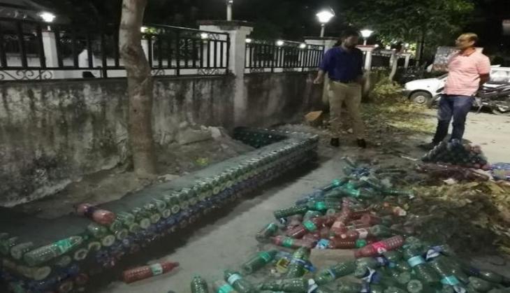 Model using empty bottles to help understand plastic waste disposal management