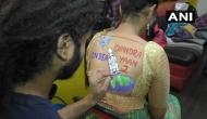 Gujarat: Youths get body paint tattoos on Article 370, Chandrayaan-2 for Garba Raas