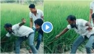 Hilarious! Man tries to catch snake from grass field, what he finds next will tickle your funny bones!