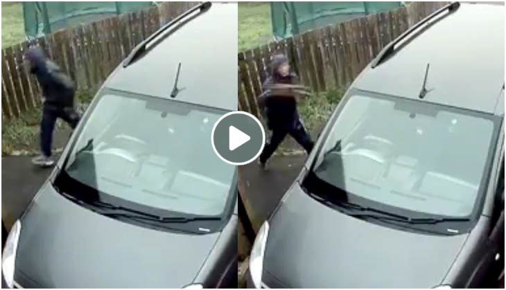 Thief tries to break car glass via brick, hit himself instead; video will teach you how karma pays back!