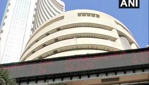 Equity indices trade 1 % lower, Bandhan Bank dips by 9.8 %