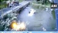 Car falls into river while avoiding accident with auto-rickshaw