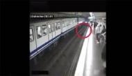Watch: Woman on phone falls in front of approaching train in scary footage