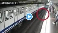 Woman falls in front of train while using phone; video will give you goosebumps!