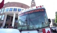 Sikh pilgrims reach Gurdwara Punja Sahib from Canada in a bus for Kartarpur Corridor opening