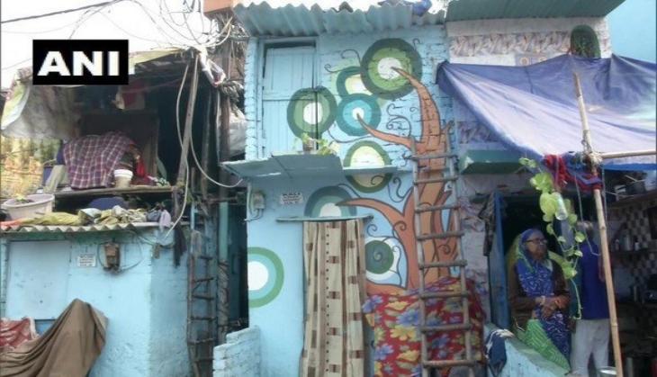 Delhi: Murals on Jhuggi walls enthuse passerby's to take pictures