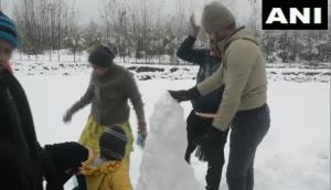 J-K: Tourists enjoy snowfall in Pahalgam