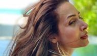 Malaika Arora shares glimpse of yoga session with pet Casper