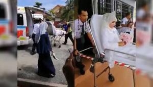 Bride and groom arrive at reception venue in ambulance for hilarious reason!