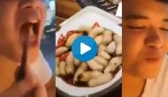 Man eats worms crawling on plate amid Coronavirus outbreak; here’s haunting video