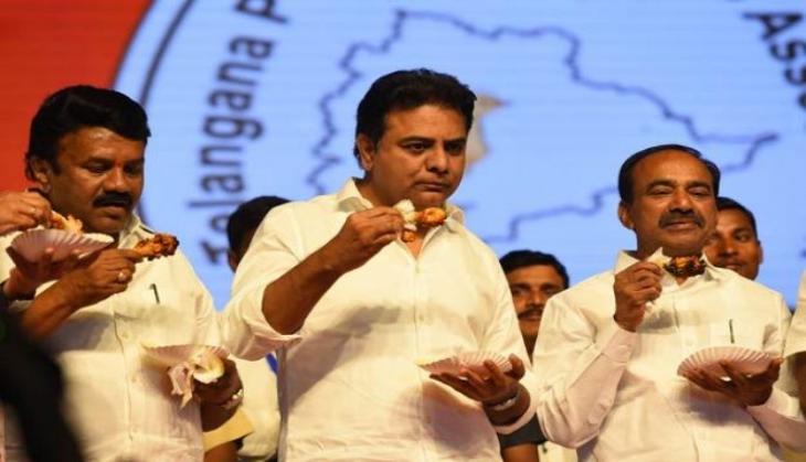 Coronavirus: TRS ministers eat chicken at public event for this bizarre reason