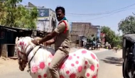 Andhra Police: Cop raises awareness while riding horse painted with images of COVID-19 [PIC]