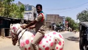 Andhra Police: Cop raises awareness while riding horse painted with images of COVID-19 [PIC]