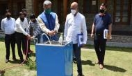 Coronavirus: Uttarakhand scientist gives demo of handwashing machine to CM Trivendra Singh Rawat
