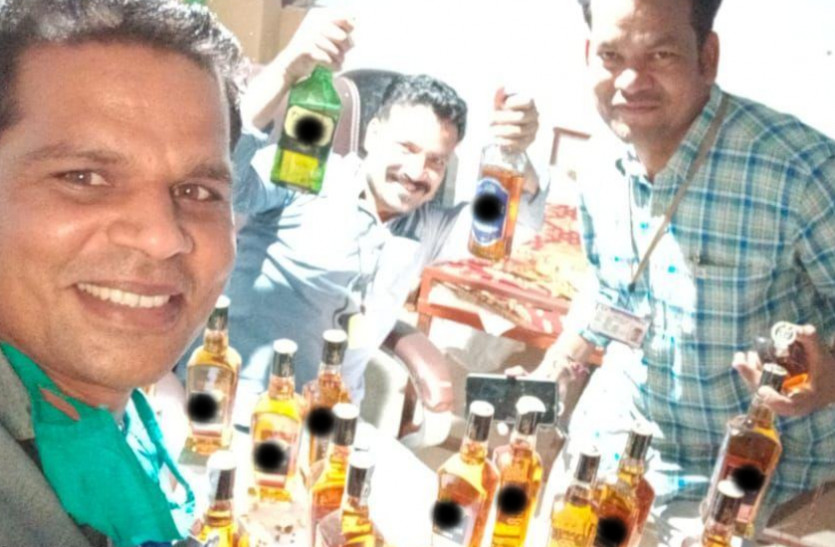 Madhya Pradesh: Three officials suspended for picture with liquor bottles