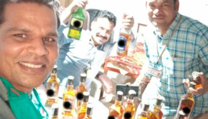 Madhya Pradesh: Three officials suspended for picture with liquor bottles