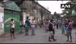 Coronavirus lockdown relaxation: Workers gather outside jute mills in Barrackpore, West Bengal 