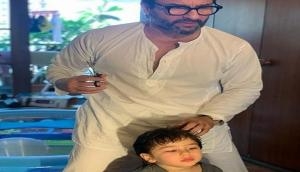 Saif Ali Khan turns hairstylist for son Taimur; see pic