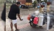 This milkman finds innovative ‘jugaad’ to supply milk while maintaining social distance; see viral pic