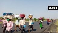 Lockdown: Braving scorching heat, migrant workers walk down to their homes