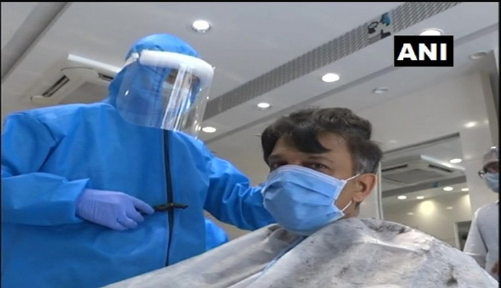 Gujarat: Workers at salon in Kheda wear PPE kits while giving haircuts 