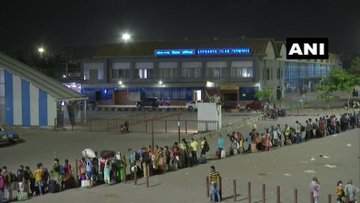 People wait for boarding 'Shramik' special trains at Mumbai's Lokmanya Tilak Terminus  
