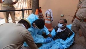 UP: Cop wearing PPE faints while screening devotees at Sri Krishna Janmasthan Temple in Mathura