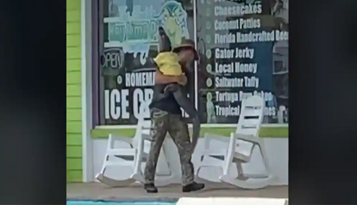 OMG! Man carries 6-year-old alligator like a baby; video goes viral