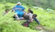 Uttarakhand: Locals carry patient on makeshift stretcher as roads remain blocked due to landslide