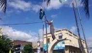 Pakistan Occupied Kashmir: Activist brings down Pakistani flags in Dadyal city