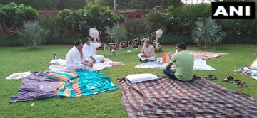 RS Deputy Chairman Harivansh arrives with tea for 8 suspended MPs who camped overnight at Parliament lawns