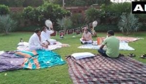 RS Deputy Chairman Harivansh arrives with tea for 8 suspended MPs who camped overnight at Parliament lawns