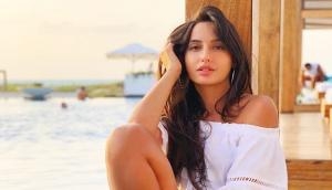 Have you seen Nora Fatehi's beach dance performance with this mystery guy?
