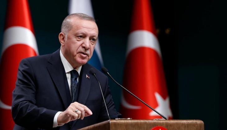Charlie Hebdo cartoon Turkey President Erdogan lifting woman's burka to look at her naked backside