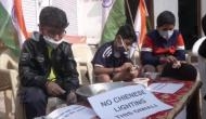 J-K: Children make earthen lamps in Jammu, boycott Chinese lights 