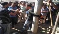 Assam journalist tied to pole, thrashed in public 