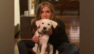 Jennifer Aniston cuddles up with pet dog on Thanksgiving: 'We're grateful'