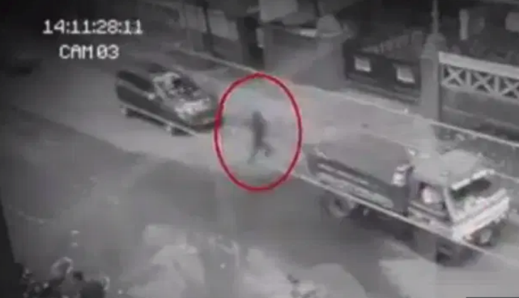 Video: Chilling moment GHOST appears to walk through oncoming traffic on a busy road in the Philippines