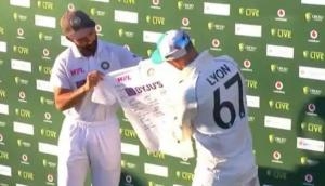 Ajinkya Rahane presents signed Indian jersey to Nathan Lyon for completing 100th Test