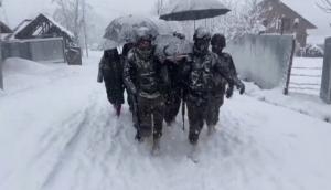 J-K: Army helps woman, her newborn reach home in snow-laden Kupwara