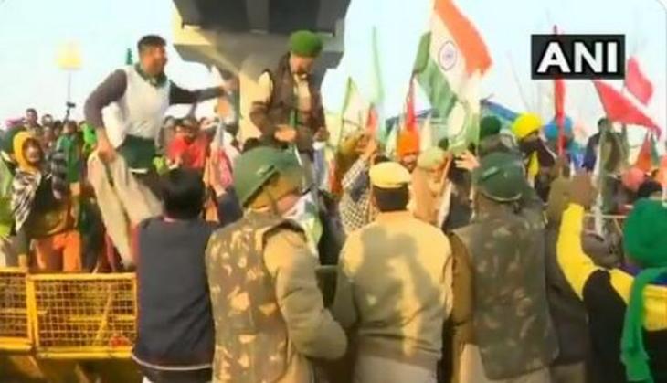 Farmers break police barricade at Tikri border, tractor rally enters Delhi