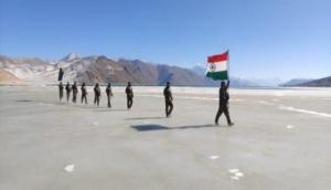 Republic Day: ITBP jawans march with national flag on frozen water body in Ladakh 